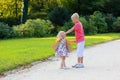 Brother and sister playing in autumn park Royalty Free Stock Photo