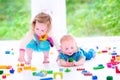 Brother and sister playing with colorful blocks Royalty Free Stock Photo