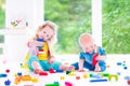 Brother and sister playing with colorful blocks Royalty Free Stock Photo