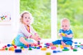 Brother and sister playing with colorful blocks Royalty Free Stock Photo