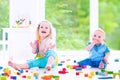 Brother and sister playing with colorful blocks Royalty Free Stock Photo