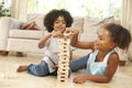 Brother And Sister Playing Game At Home