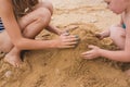 Children build from the sand on the beach Royalty Free Stock Photo