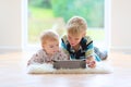 Brother and sister playing with tablet pc