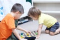 Brother and sister playing together, siblings play home on chess Royalty Free Stock Photo