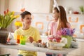Brother and sister preparing Easter colorful eggs Royalty Free Stock Photo