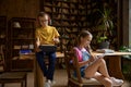 Brother and sister schoolchildren studying at home together Royalty Free Stock Photo