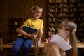 Brother and sister schoolchildren studying at home together Royalty Free Stock Photo