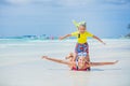 Brother and sister in scuba masks playing on the beach during the hot summer vacation day. Royalty Free Stock Photo