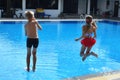 Friendly children to move into the water. Brother and sister swimming in the summer. Diving into water