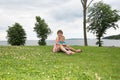 Brother and sister sitting on grass Royalty Free Stock Photo