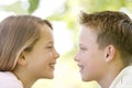 Brother and sister sitting outdoors Royalty Free Stock Photo