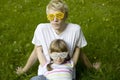 Brother and sister in strange sunglasses sitting