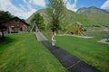 Brother with sister swinging in playground at Hallstatt, Austria Royalty Free Stock Photo