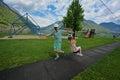 Brother with sister swinging in playground at Hallstatt, Austria Royalty Free Stock Photo