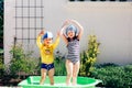 Brother and sister taking a bath outdoor Royalty Free Stock Photo