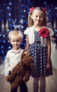 Boy and girl with a toy bear Royalty Free Stock Photo