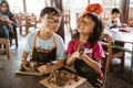 Brother and sister try to make handicrafts Royalty Free Stock Photo