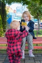 Brother and sister are walking in the park Royalty Free Stock Photo