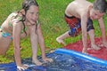 Brother and sister in water play Royalty Free Stock Photo