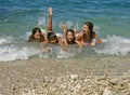 Brother and sisters enjoy on waves Royalty Free Stock Photo