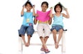 Brother and two sisters holding books Royalty Free Stock Photo