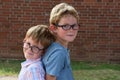 Brothers, both with glasses playing together