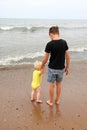 Two brothers children playing on the sand beach by the sea Royalty Free Stock Photo