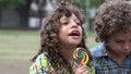 Brothers Eating Lollipop Candy