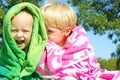 Brothers Giggling Wrapped in Beach Towels Royalty Free Stock Photo