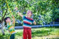 Brothers having fun splash each other with water in the village