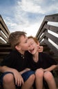 Brothers laughing on steps