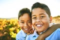 Brothers out and about. Portrait of two little brothers taking a selfie together outdoors.