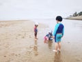 3 kids play sand on the beach. Royalty Free Stock Photo