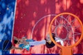 Brothers playing basketball One On One on outdoor court. Royalty Free Stock Photo