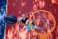 Brothers playing basketball One On One. Royalty Free Stock Photo