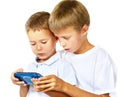 Brothers playing handheld game console Royalty Free Stock Photo