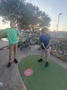 Brothers playing puttputt