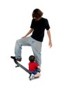 Brothers Playing On Skateboard Royalty Free Stock Photo