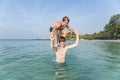 Brothers are playing together in a beautiful sea with crystal clear water Royalty Free Stock Photo