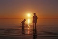 Brothers playing in the water at the Great Salt Lake beach Royalty Free Stock Photo