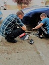 Brothers are repairing car Royalty Free Stock Photo