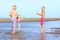 Brothers and sister playing on the beach Royalty Free Stock Photo