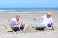 Brothers and sister playing on the beach Royalty Free Stock Photo