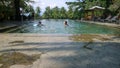 brothers and sisters swimming in the pool Royalty Free Stock Photo