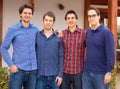 Brothers standing together. Portrait of a group of young men standing outdoors. Royalty Free Stock Photo