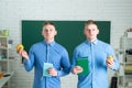 Brothers student learning in the university. Two attractive positive smile young students standing and holding book Royalty Free Stock Photo
