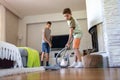 Brothers vacuuming floor at home Royalty Free Stock Photo