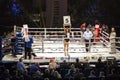 Brovary. Ukraine, 14.11.2015 Ring girl, reffere are in the center, boxers are in the corners inside the boxing ring.