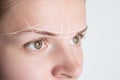 Brow marking and measuring before microblading or henna tattoo close-up. White brow paste, threading Royalty Free Stock Photo